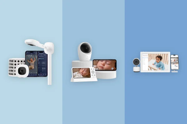 Baby video monitor on a nursery nightstand with soft ambient lighting
