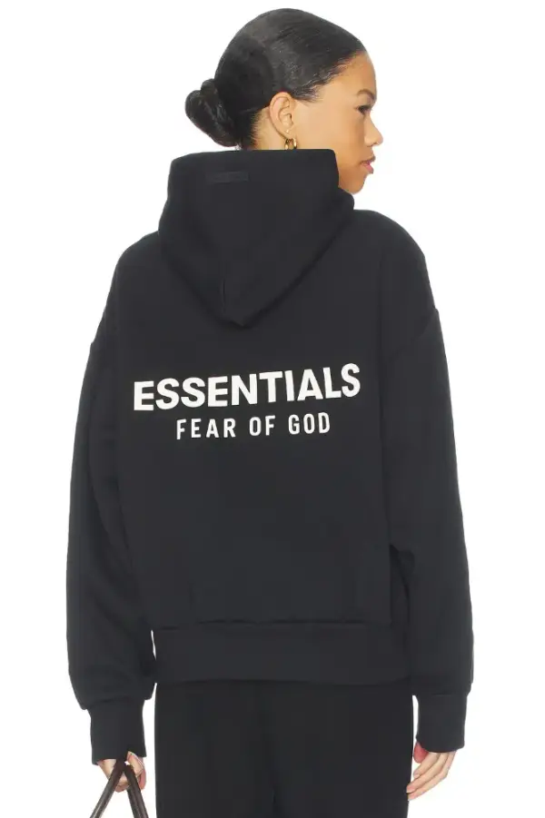 Fear of God ESSENTIALS Fleece Hoodie in Black | REVOLVE